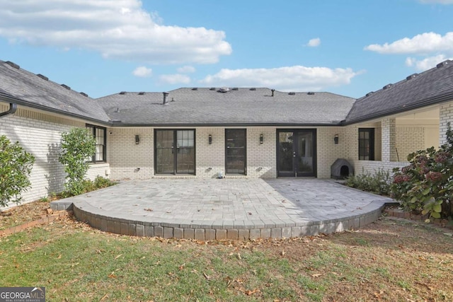 back of house featuring a yard and a patio area