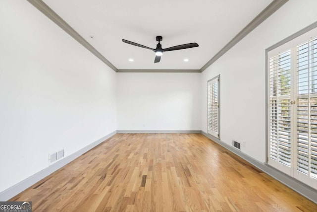 unfurnished bedroom featuring ceiling fan, multiple windows, ornamental molding, and light hardwood / wood-style flooring