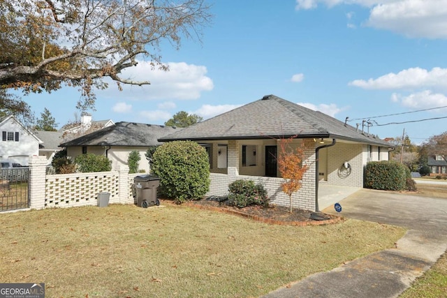 view of side of home featuring a lawn