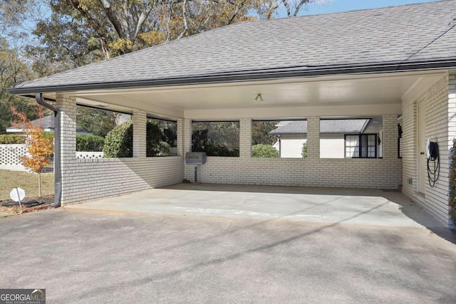 view of parking with a carport