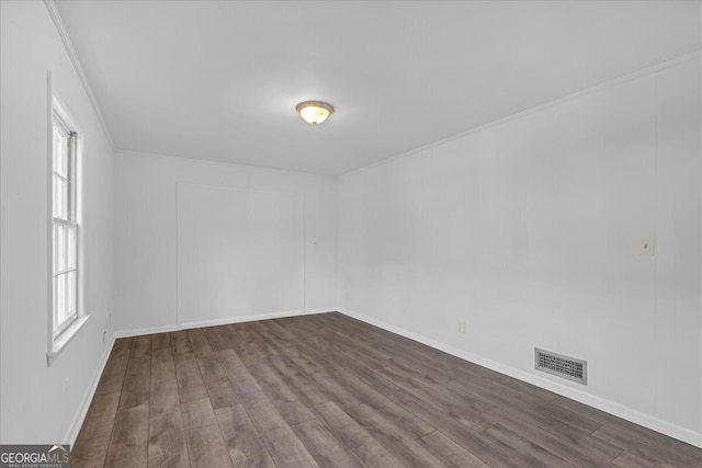 spare room with dark wood-type flooring