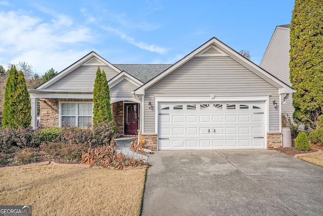 ranch-style home featuring a garage