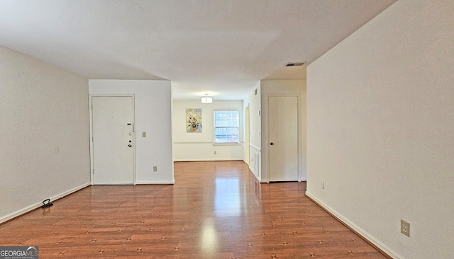 empty room featuring wood-type flooring