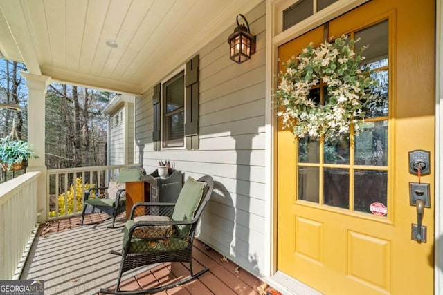 wooden terrace featuring a porch