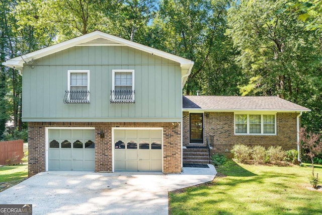 tri-level home with a front lawn and a garage