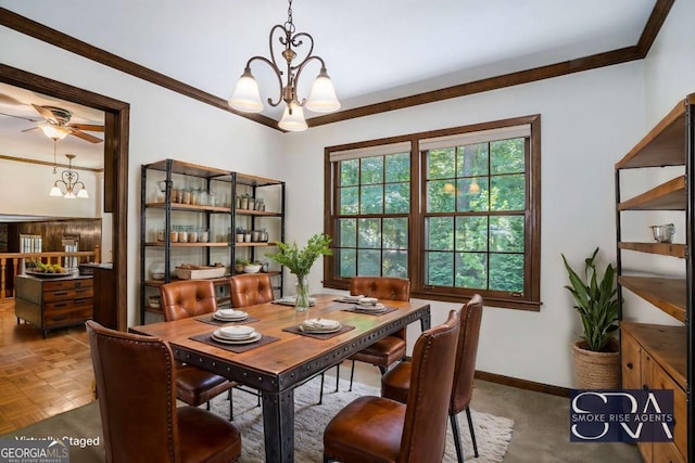 dining space featuring dark parquet floors, crown molding, and ceiling fan with notable chandelier