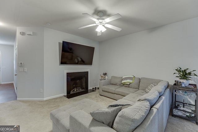 living room featuring ceiling fan and carpet floors