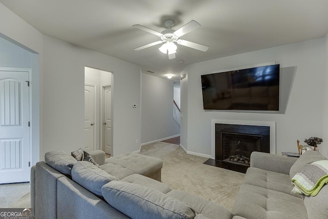 living room with ceiling fan and light carpet