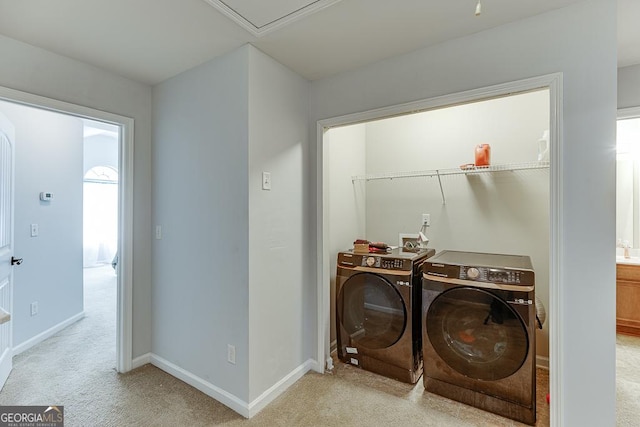 washroom featuring light colored carpet and separate washer and dryer