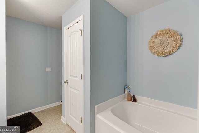 510 Jefferson Chase St, Atlanta, GA 30354 - carpeted bedroom featuring lofted ceiling and baseboards