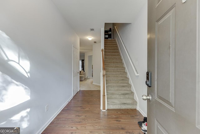 foyer entrance with hardwood / wood-style floors