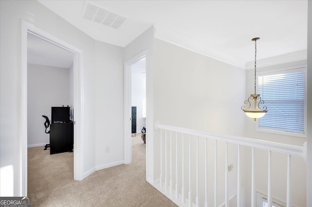 corridor featuring light carpet and ornamental molding