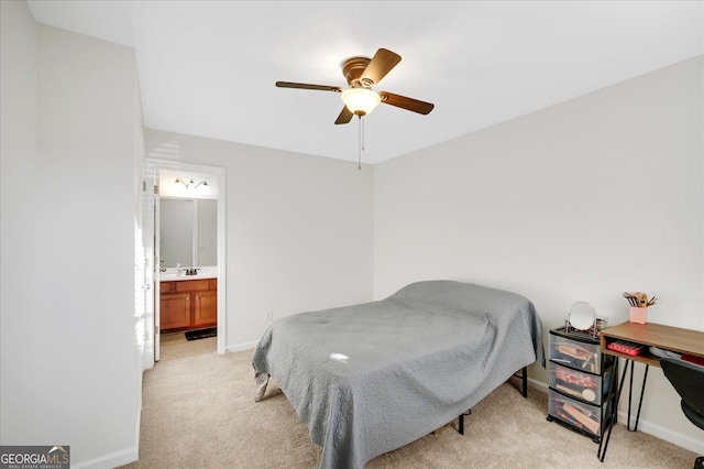 carpeted bedroom featuring ensuite bathroom and ceiling fan