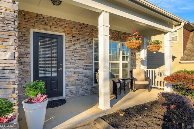 doorway to property featuring a porch