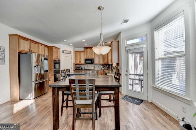 dining area featuring light hardwood / wood-style flooring