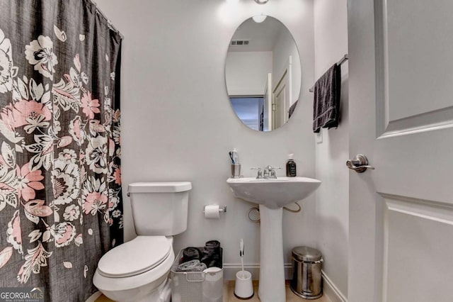 bathroom featuring sink and toilet