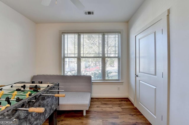 bedroom with ceiling fan and hardwood / wood-style flooring