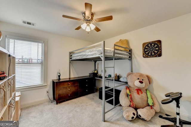 bedroom with ceiling fan and light colored carpet