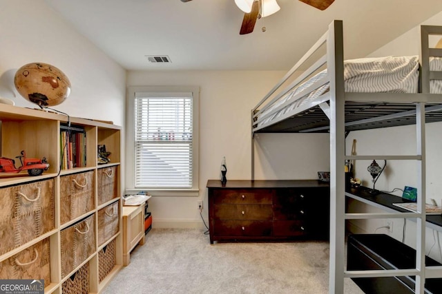 bedroom featuring ceiling fan and light colored carpet