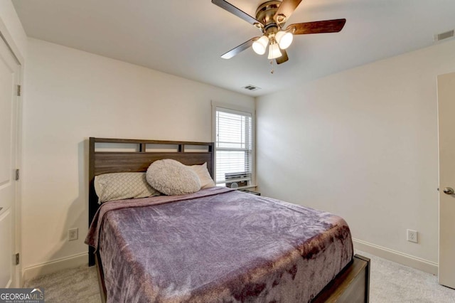 bedroom with ceiling fan and light colored carpet