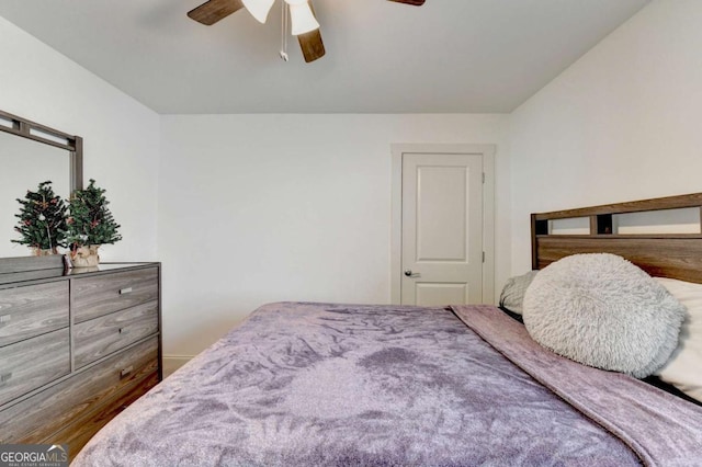 bedroom featuring ceiling fan and wood-type flooring