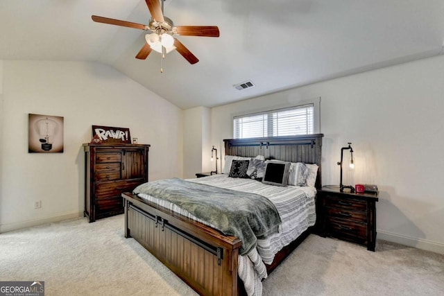 bedroom with ceiling fan, light colored carpet, and vaulted ceiling