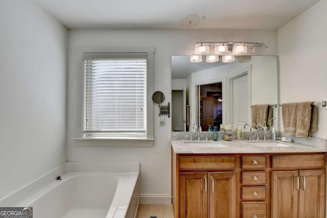 bathroom featuring vanity and a bathing tub