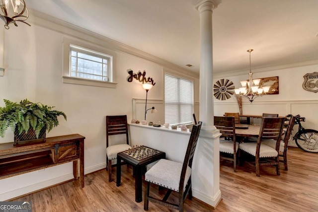 sitting room featuring a chandelier, hardwood / wood-style floors, and a healthy amount of sunlight