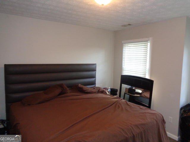 bedroom with a textured ceiling