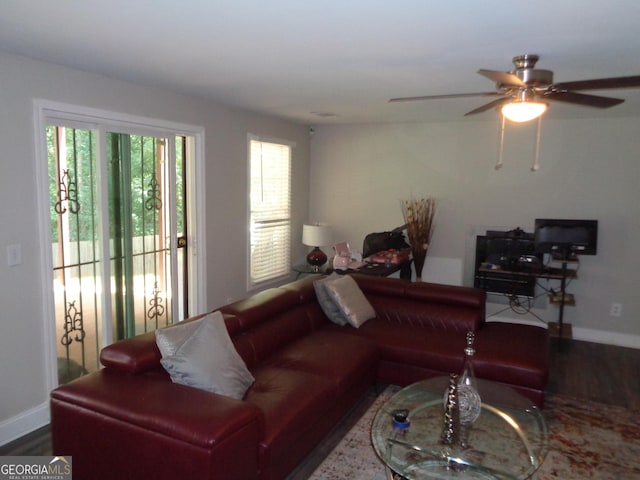 living room featuring hardwood / wood-style flooring and ceiling fan