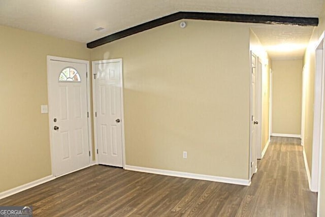 entrance foyer with wood-type flooring and vaulted ceiling with beams