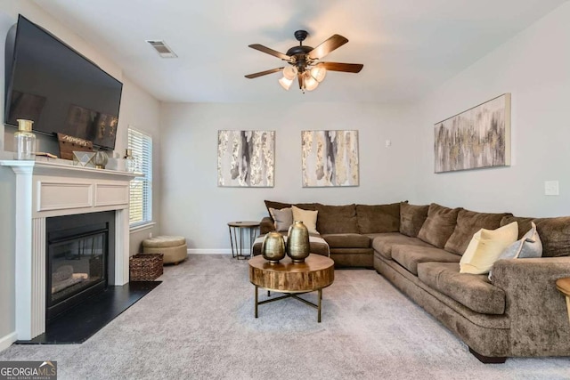 living room with carpet floors and ceiling fan