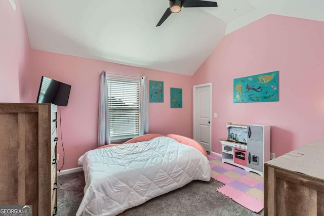 carpeted bedroom with ceiling fan and vaulted ceiling