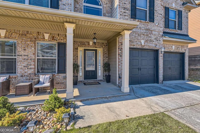 property entrance featuring covered porch and a garage