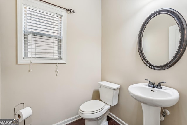 bathroom with toilet and sink