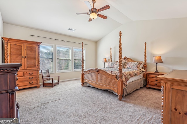 bedroom featuring ceiling fan, light carpet, and vaulted ceiling