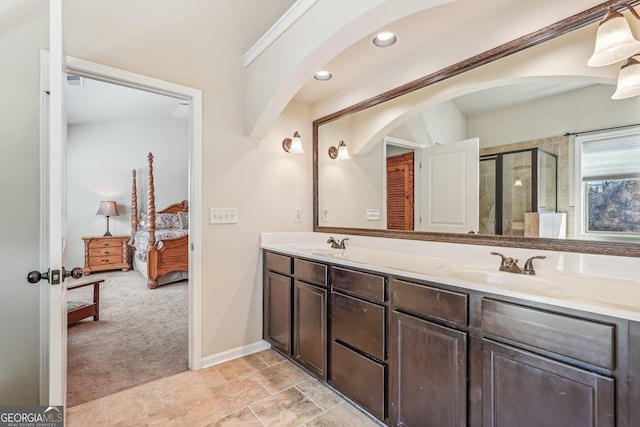 bathroom with vanity and an enclosed shower