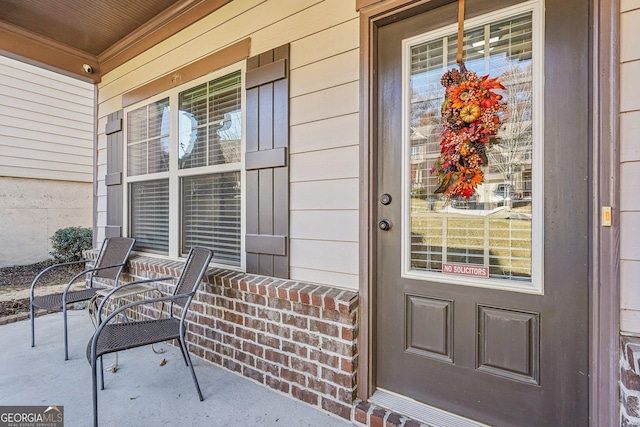 doorway to property with a porch