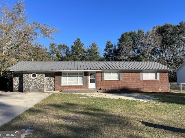 ranch-style home with a front lawn