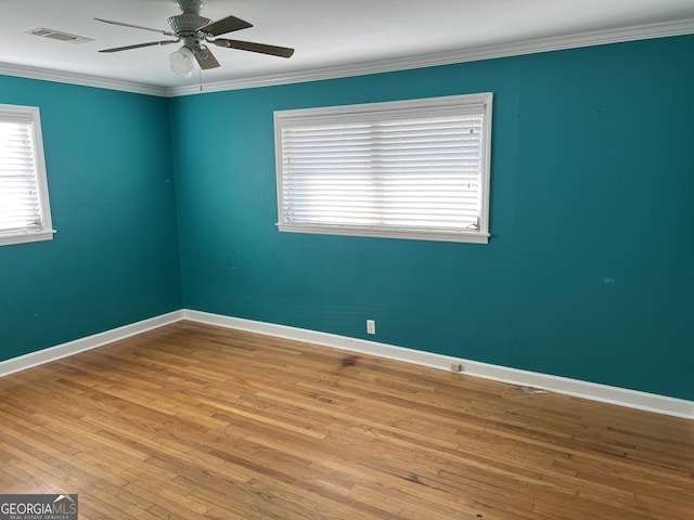 unfurnished room featuring crown molding, ceiling fan, and light hardwood / wood-style flooring