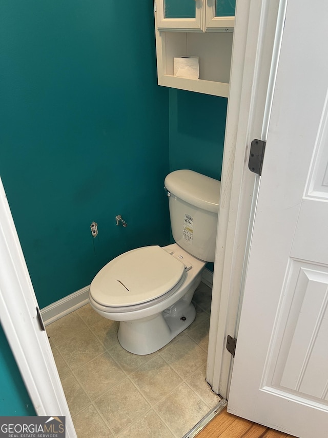 bathroom featuring tile patterned floors and toilet