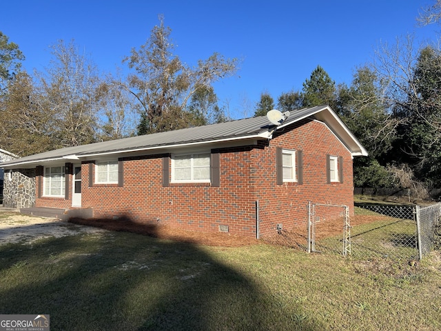 view of property exterior with a lawn