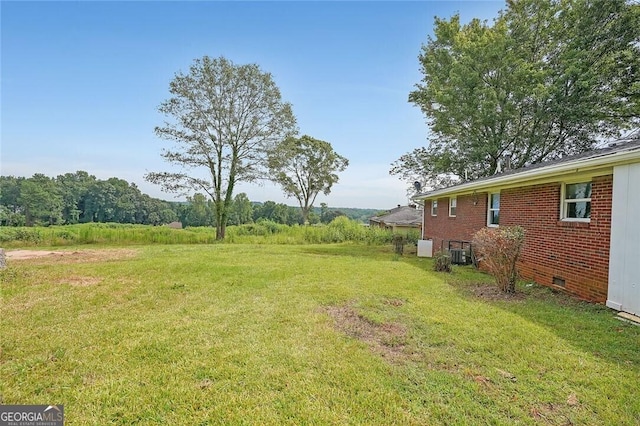 view of yard with central AC unit