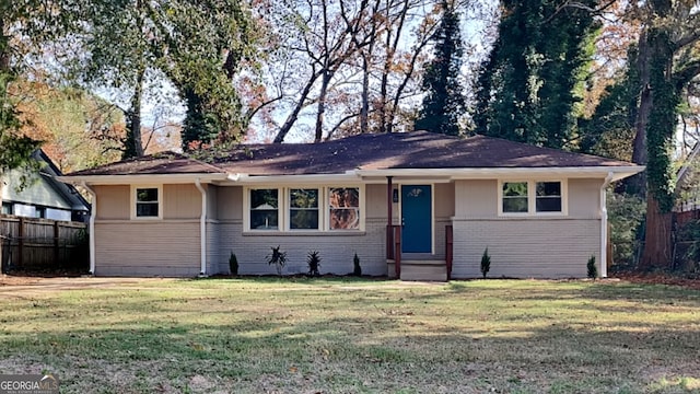 ranch-style home featuring a front yard