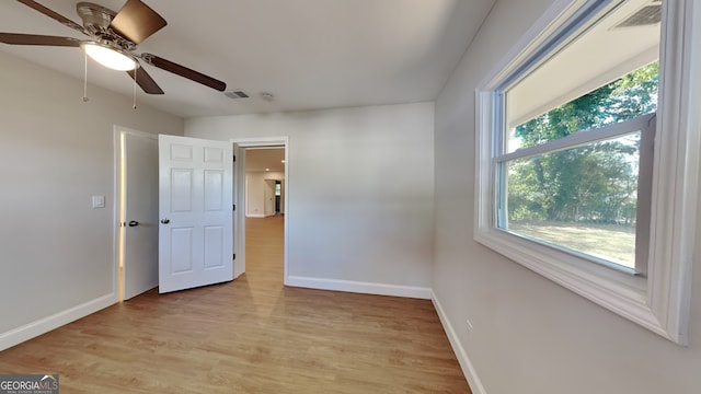 spare room with ceiling fan and light hardwood / wood-style floors