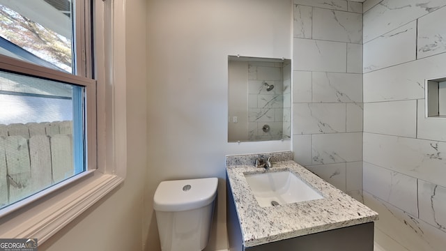 bathroom with vanity and toilet