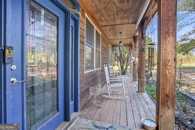 wooden deck featuring covered porch