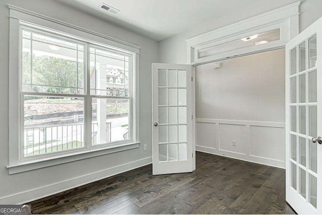 interior space featuring french doors and dark hardwood / wood-style floors