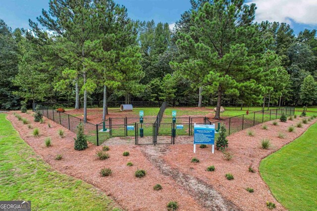 view of home's community featuring a lawn