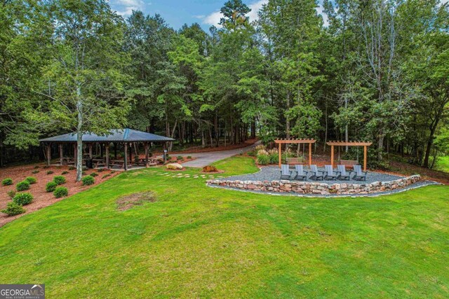 view of yard featuring a pergola and a gazebo